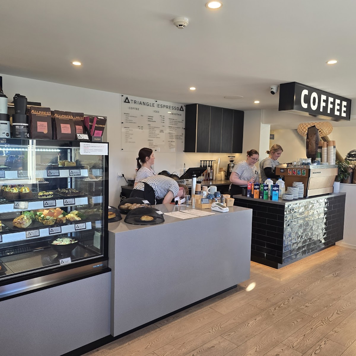 The Triangle Espresso counter with Allpress beans and the menu board
